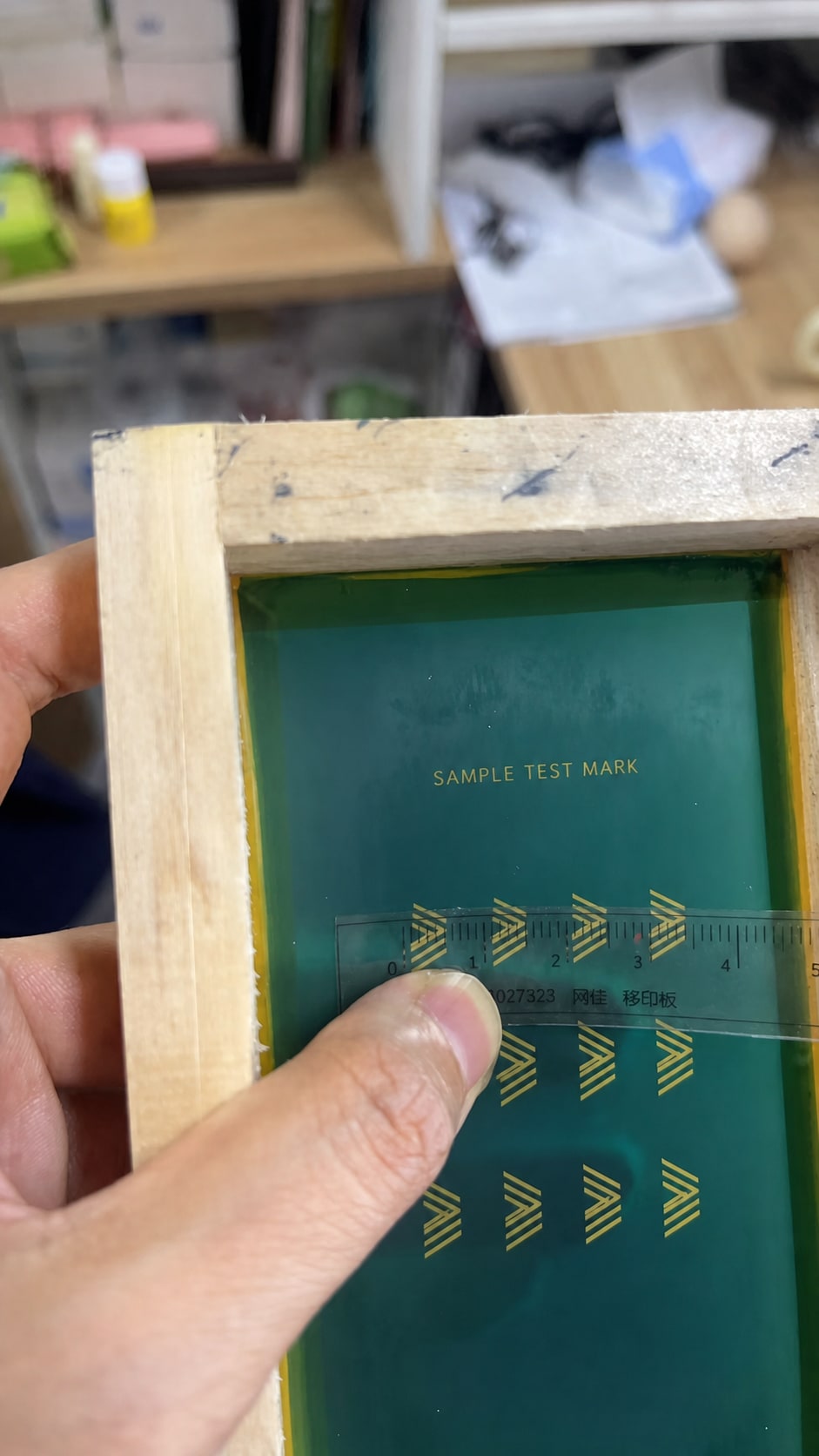 Measuring an eyewear temple logo on a printing stencil